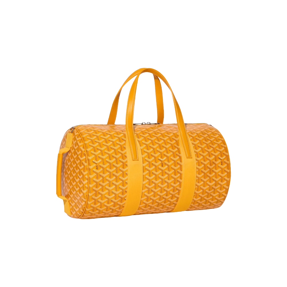 Angled view of Goyard Barrel 40 Sports Bag in Yellow highlighting adjustable strap attachments and premium calfskin trim – shop designer bags at McKickz.