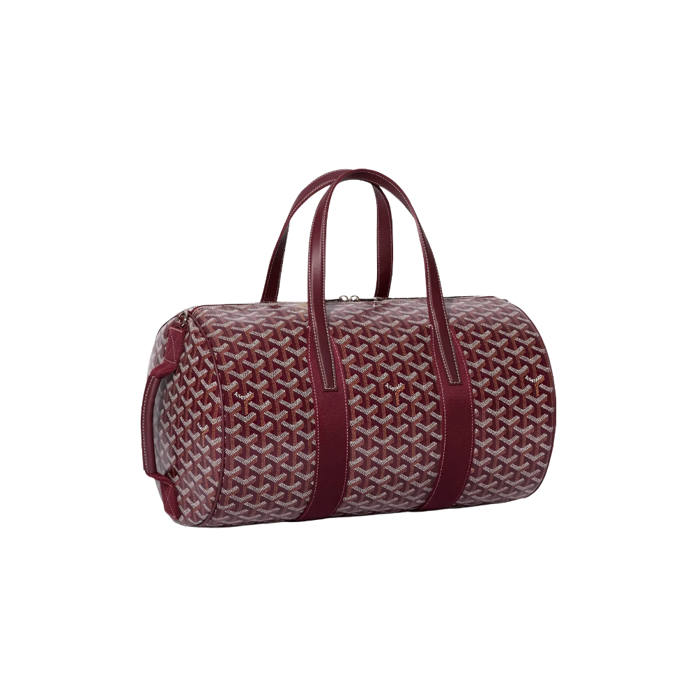 Angled view of Goyard Barrel 40 Sports Bag in Burgundy Red highlighting adjustable strap attachments and premium calfskin trim – shop designer bags at McKickz.